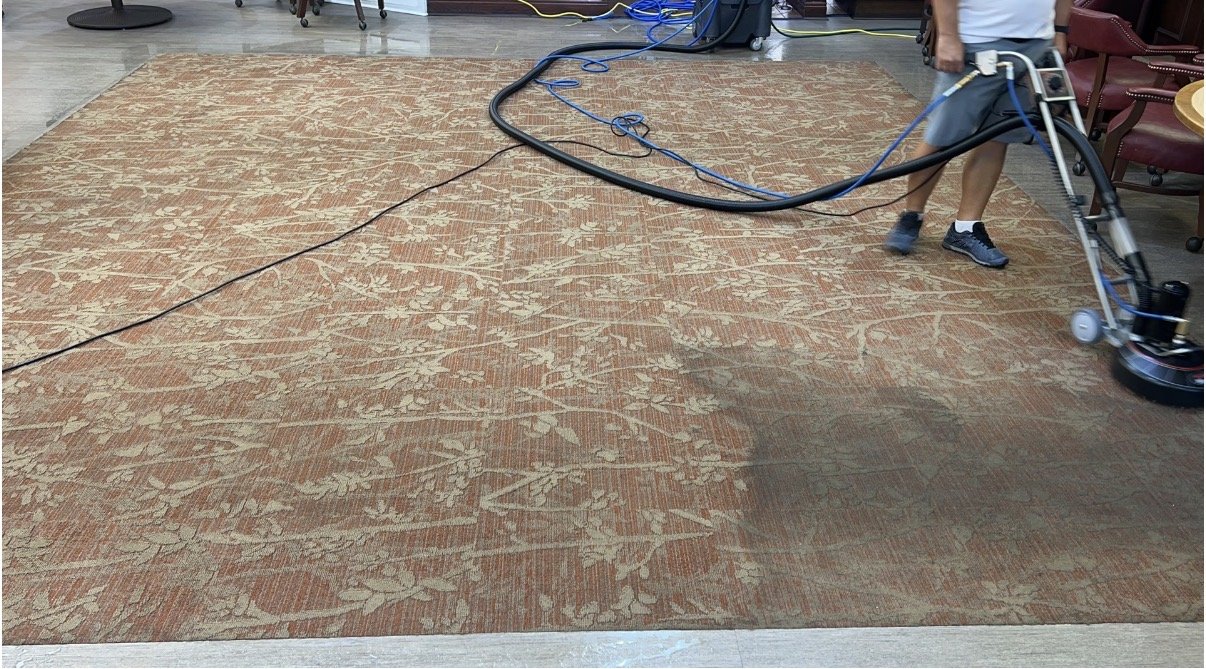 Hot water extraction lifting dirt from lobby carpet