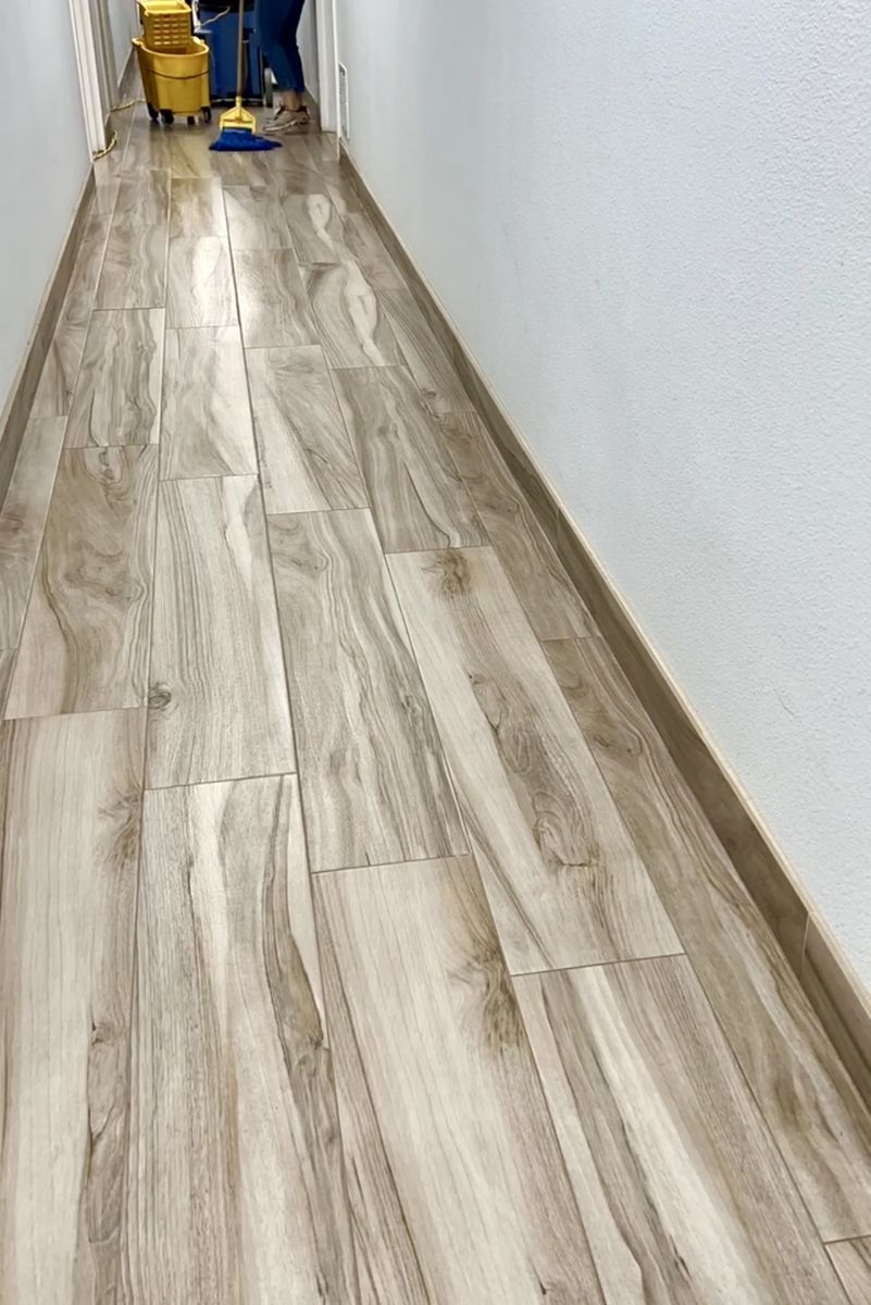 Wood-look vinyl hallway floor after strip and wax