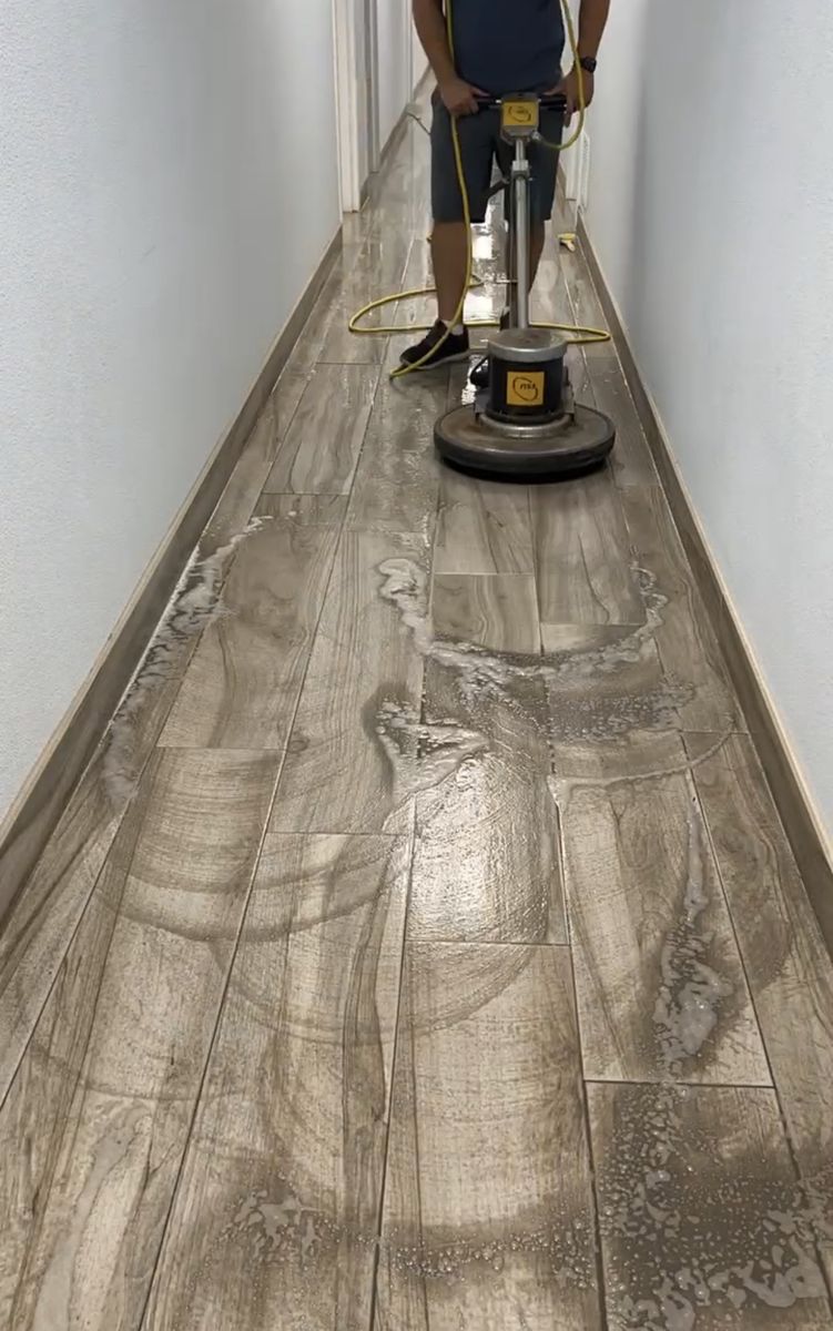 Wood-look vinyl hallway floor before strip and wax